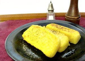 Polenta is easy to make at home. You can either eat it all at once, or cool, slice, and keep it to reheat later when you need a quick, easy meal. 