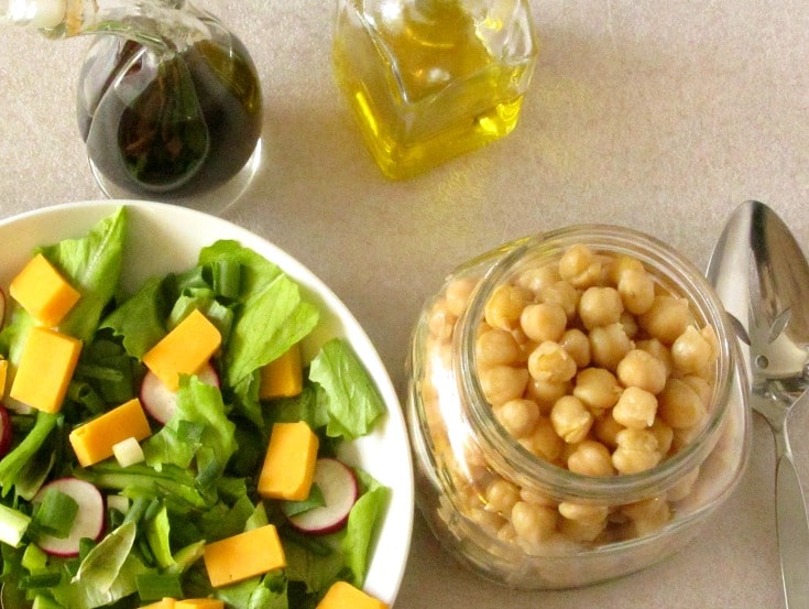 Marinate chickpeas for a flavorful addition to a salad. This easy recipe takes only five minutes, but adds so much to your meal! 