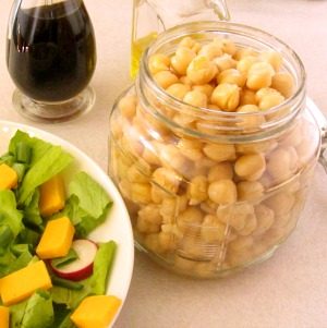 Marinate chickpeas for a flavorful addition to a salad. This easy recipe takes only five minutes, but adds so much to your meal!