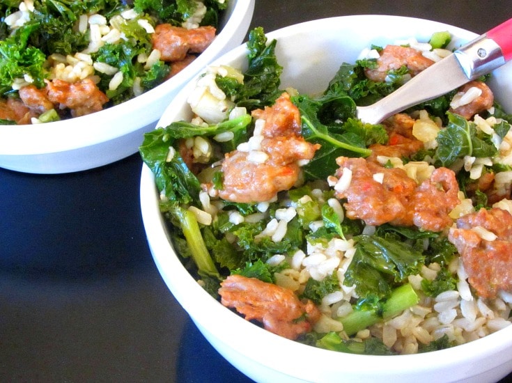 Italian Sausage and Kale come together in a rice bowl for a quick and easy, but hearty and delicious, skillet meal! 