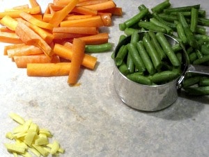 Carrots, greeen beans and ginger cut for the recipe.