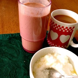Chocolate protein shake, grits, and coffee