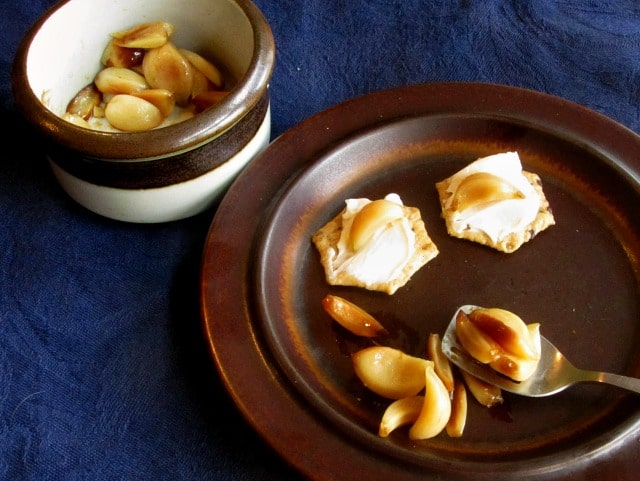 Delicious roasted garlic can be so messy and annoying to use! Here's a method to prepare it that takes a little work upfront, but gives you a neat and easy to use condiment. 