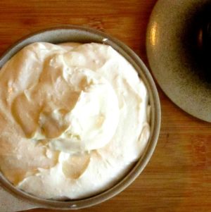 A serving bowl of Roasted Garlic Whipped Feta