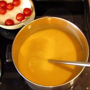 Pot or red lentil soup, pureed, on stovetop.