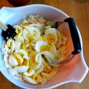 Bowl of eggs being chopped 