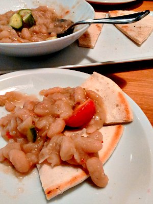 Stewed cannelini beans on pita