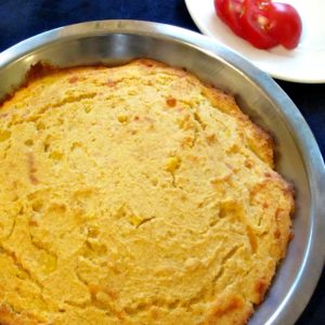 Cornbread with corn and cheese, in baking pan.