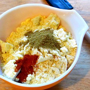 Mixing bowl with cornbread mix and spices