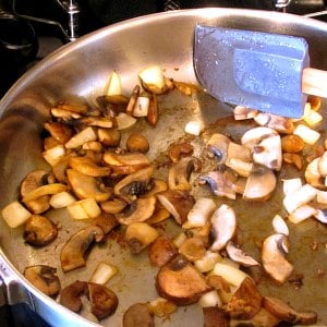 mushrooms and onion cooking in bacon grease