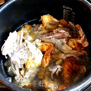 Chicken bones and water in pressure cooker. 