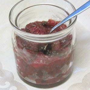 A decorative jar of cranberry sauce 