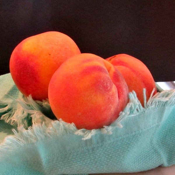 Golden peaches in a bowl
