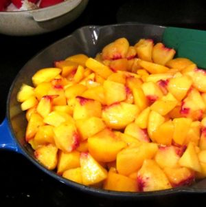 Pan full of peeled and chopped peaches