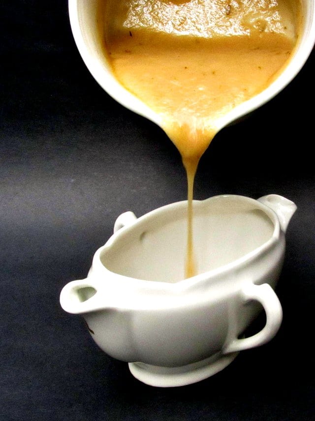 Pouring Instant Gluten Free Chicken Gravy into the serving dish.