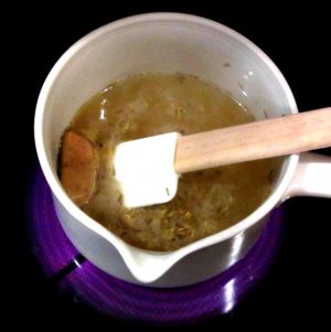 Broth in saucepan with roux cubes