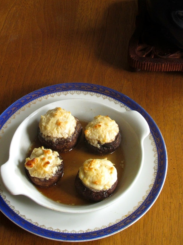 Super easy Cheese Stuffed Mushrooms will be a hit at your next holiday get together! Combine caramelized onions with creamy cheese and savory mushrooms.