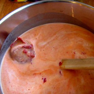 Stirring tomato paste into Red Pepper Soup