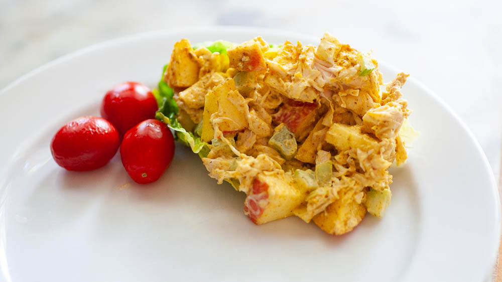 Curried cchicken salad with cherry tomatoes.